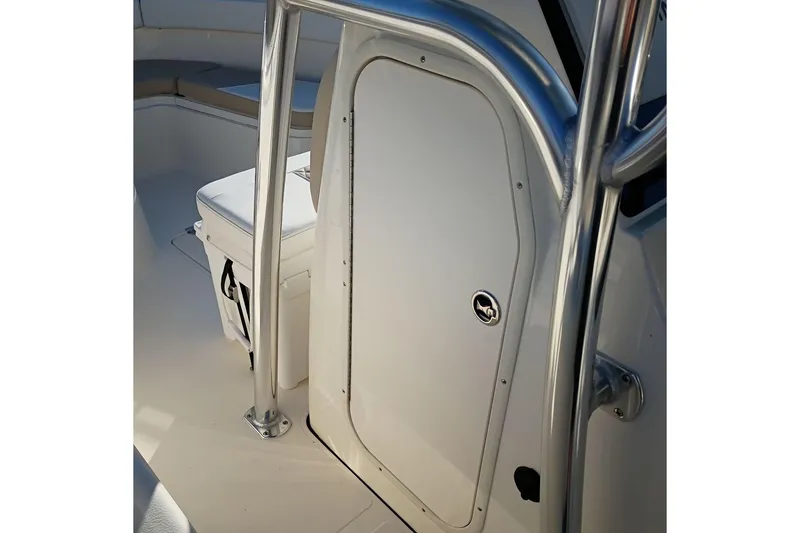 Slide: The Image of 2026 Bulls Bay 255 Center Console boat interior with seating and storage. - 25