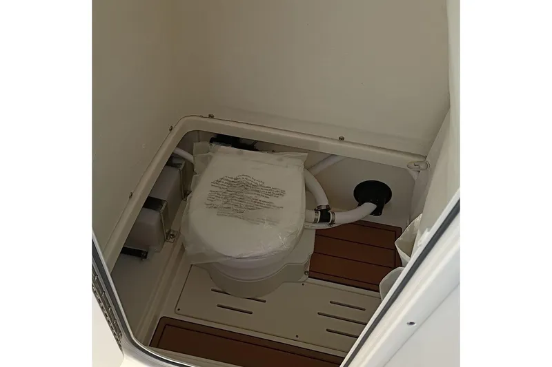 Slide: The Image of 2026 Bulls Bay 255 Center Console boat toilet interior view. - 27