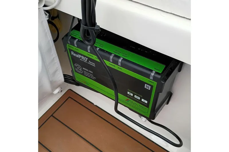 Slide: The Image of Battery charger in 2026 Bulls Bay 255 Center Console boat interior. - 29