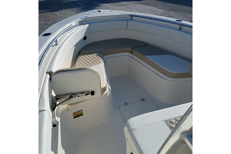 Slide: The Image of 2026 Bulls Bay 255 Center Console boat interior with cushioned seating and storage. - 31
