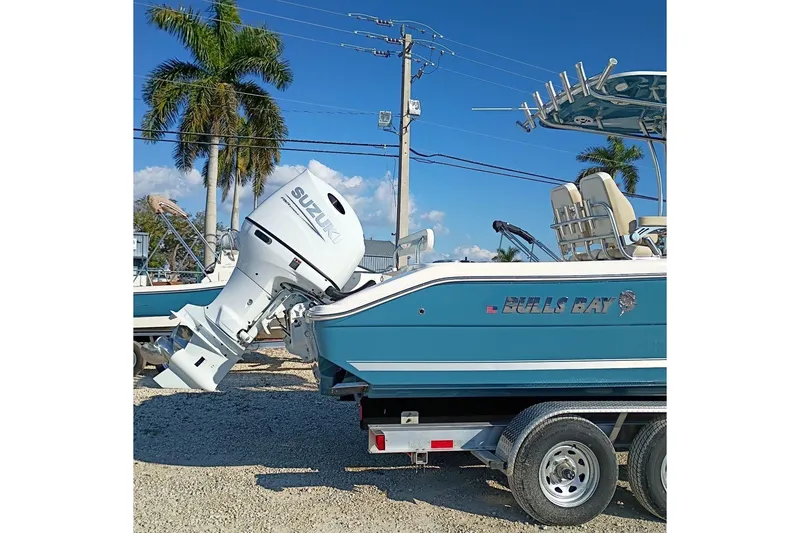 Slide: The Image of 2026 Bulls Bay 255 Center Console boat with Suzuki outboard motor on trailer. - 4