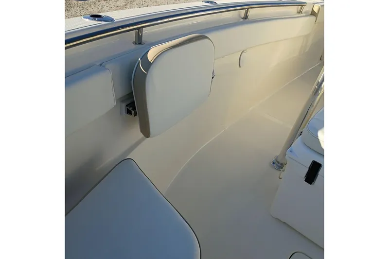 Slide: The Image of 2026 Bulls Bay 255 Center Console boat interior with cushioned seating and stainless steel railings. - 43