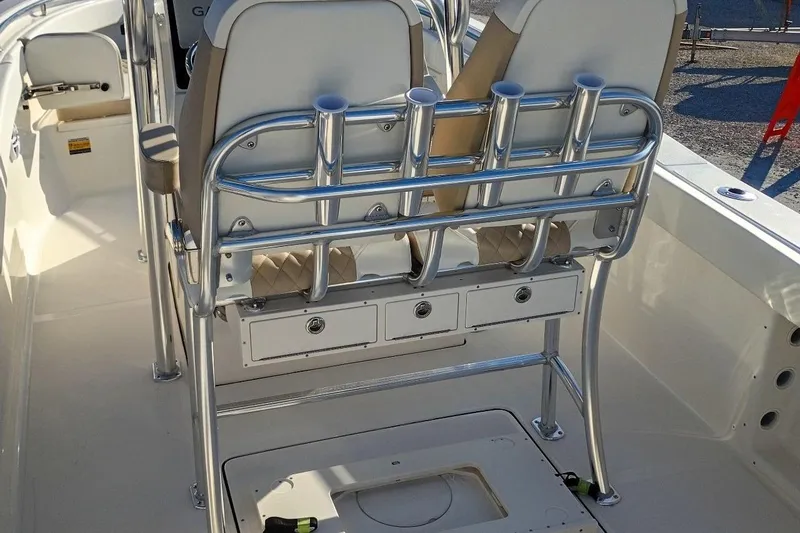Slide: The Image of 2026 Bulls Bay 255 Center Console boat interior with rod holders and storage compartments. - 49