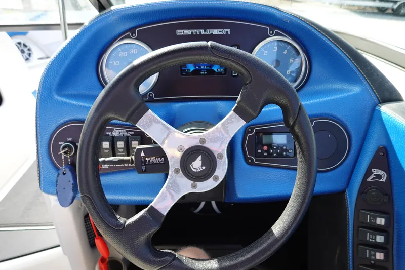 Slide: The Image of Steering wheel and dashboard of a 2013 Centurion Enzo SV230 Plus boat. - 11