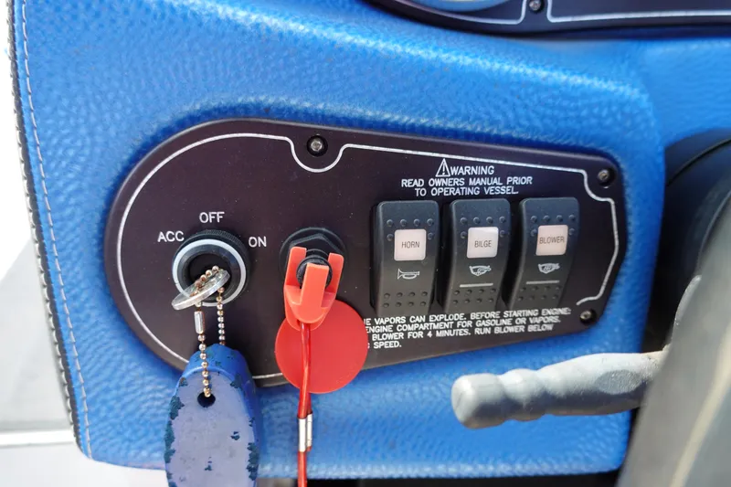 Slide: The Image of Control panel of a 2013 Centurion Enzo SV230 Plus boat with ignition and switches. - 13