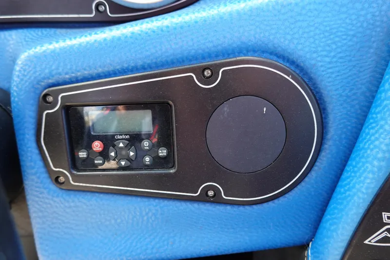 Slide: The Image of 2013 Centurion Enzo SV230 Plus dashboard with Clarion audio controls. - 14