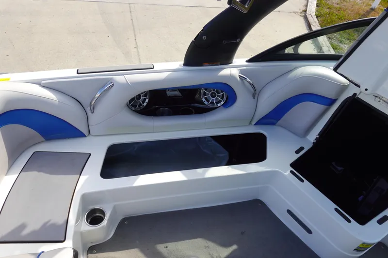 Slide: The Image of 2013 Centurion Enzo SV230 Plus boat interior with seating and speaker system. - 17