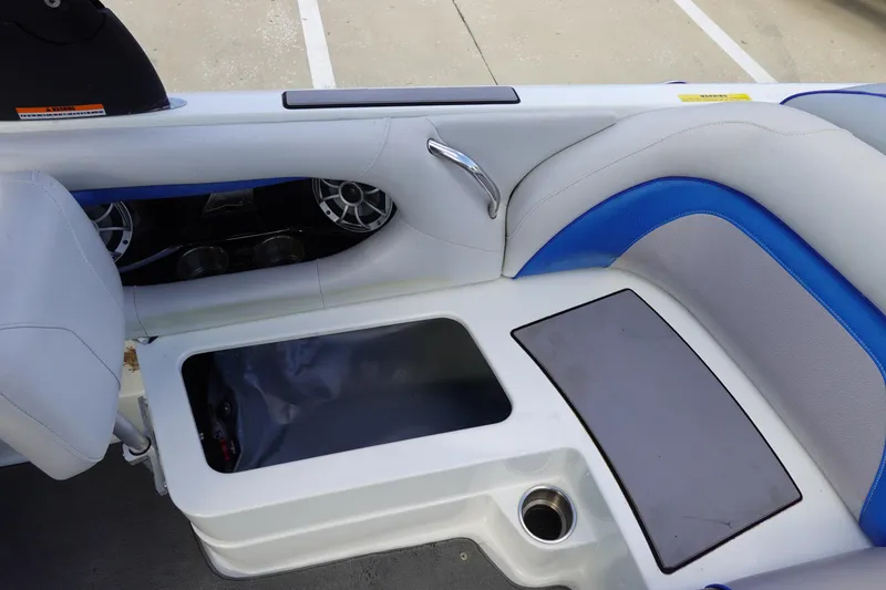 Slide: The Image of 2013 Centurion Enzo SV230 Plus boat interior with storage compartment and seating. - 21