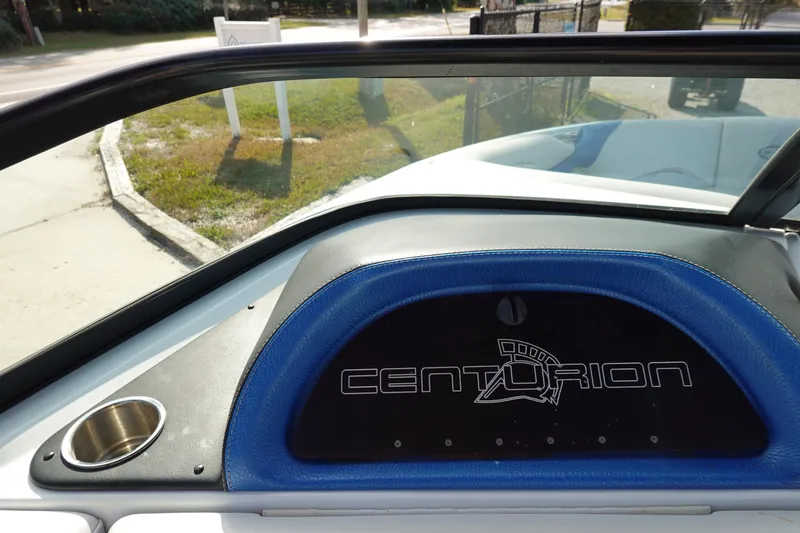Slide: The Image of 2013 Centurion Enzo SV230 Plus dashboard with logo and cup holder. - 23