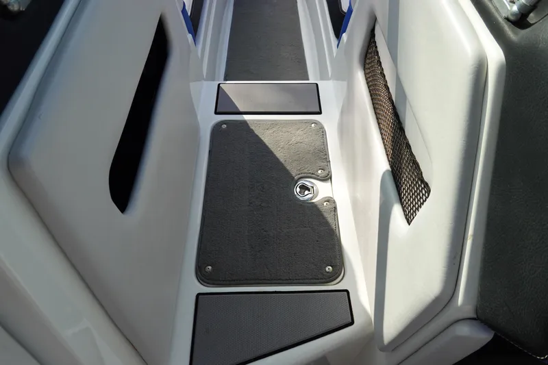 Slide: The Image of 2013 Centurion Enzo SV230 Plus boat interior walkway with storage compartment. - 24