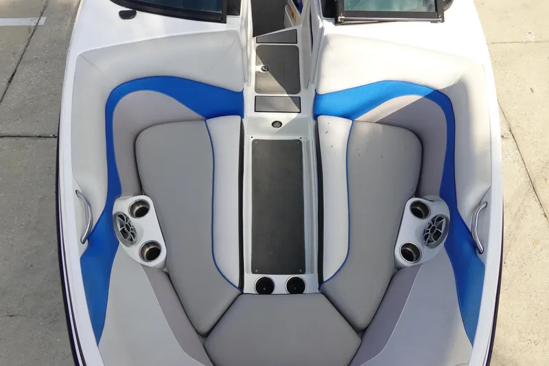 Slide: The Image of 2013 Centurion Enzo SV230 Plus boat interior with gray and blue seating. - 26
