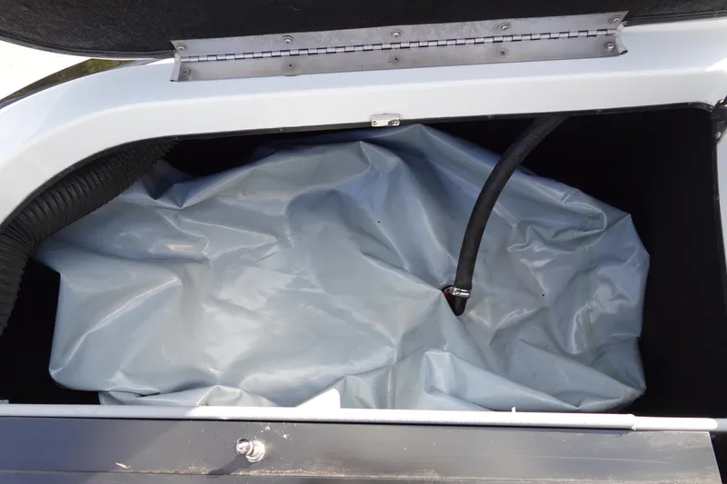 Slide: The Image of 2013 Centurion Enzo SV230 Plus ballast bag in storage compartment. - 32