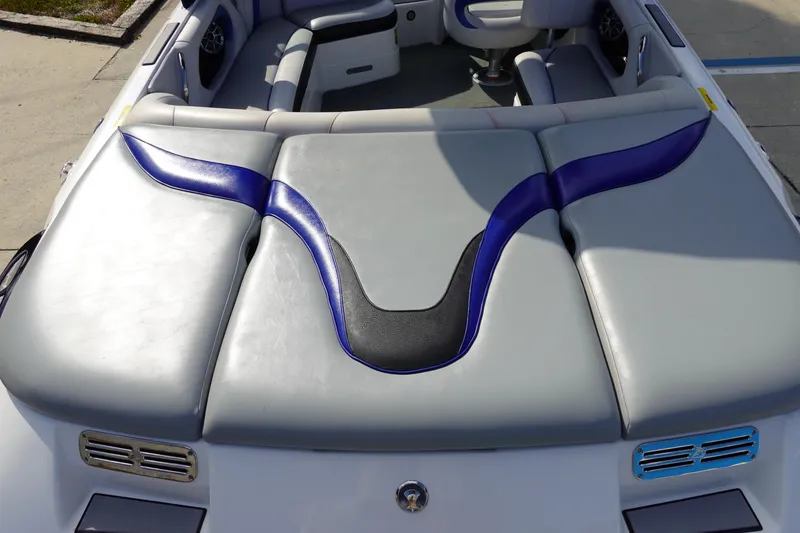 Slide: The Image of 2013 Centurion Enzo SV230 Plus boat interior with gray and blue seating design. - 7