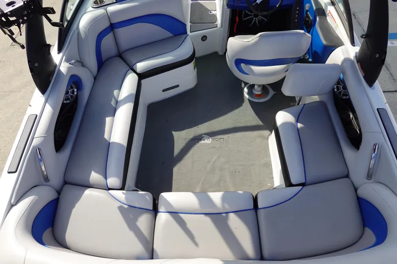 Slide: The Image of 2013 Centurion Enzo SV230 Plus boat interior with gray and blue seating. - 8