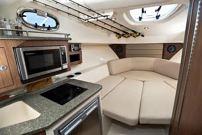 Slide: The Image of Luxurious interior of 2025 Boston Whaler 285 Conquest boat with modern amenities. - 14