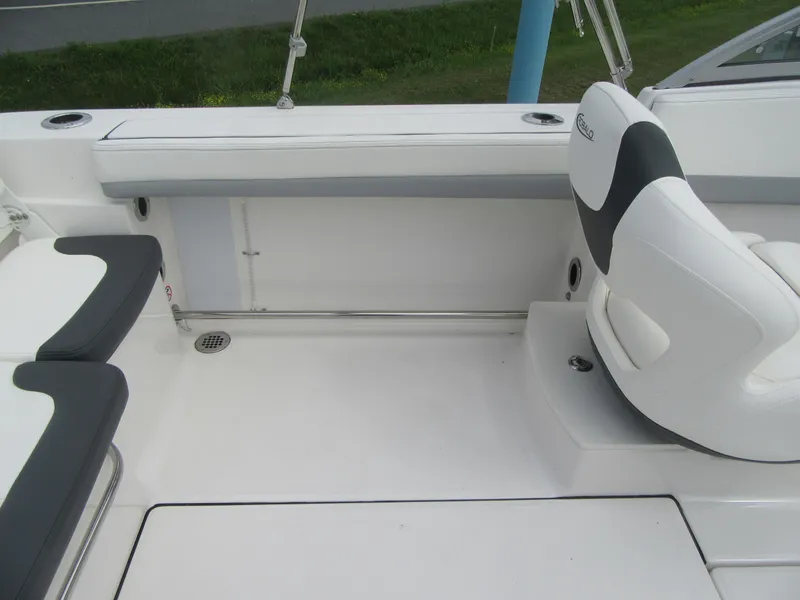 Slide: The Image of 2025 Robalo R207 Dual Console interior with white seating and sleek design. - 11