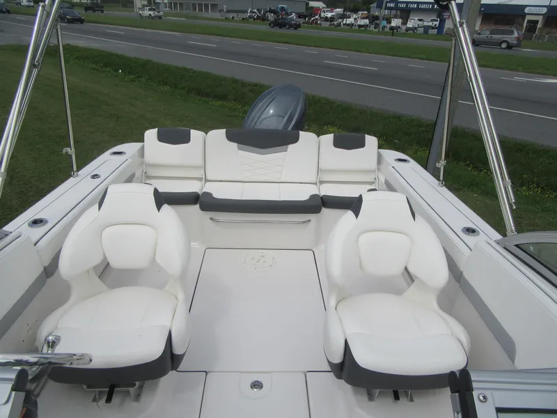 Slide: The Image of 2025 Robalo R207 Dual Console boat interior with white seating and modern design. - 8