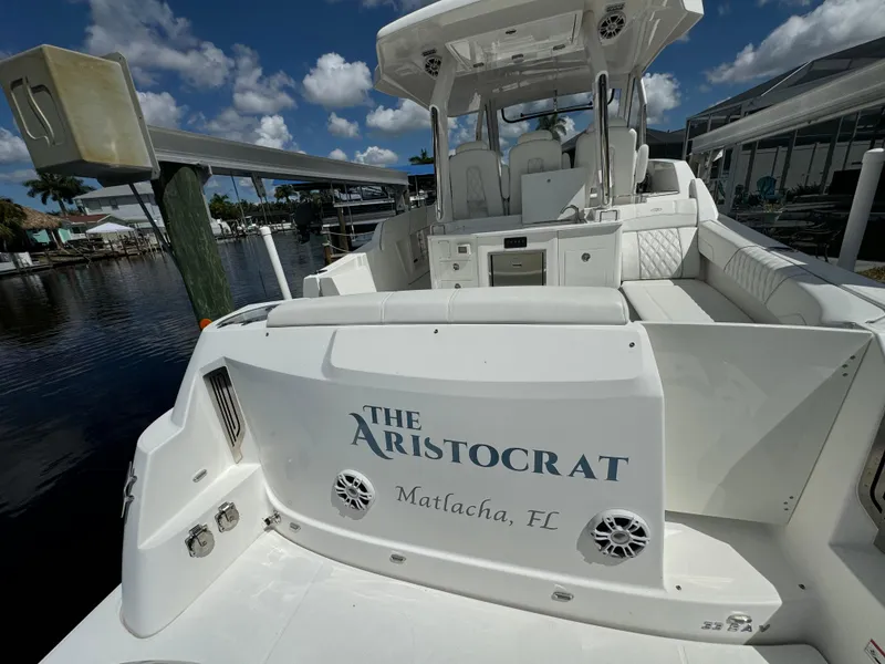 Slide: The Image of 2022 Regal 33 SAV boat named "The Aristocrat" docked in Matlacha, FL. - 4