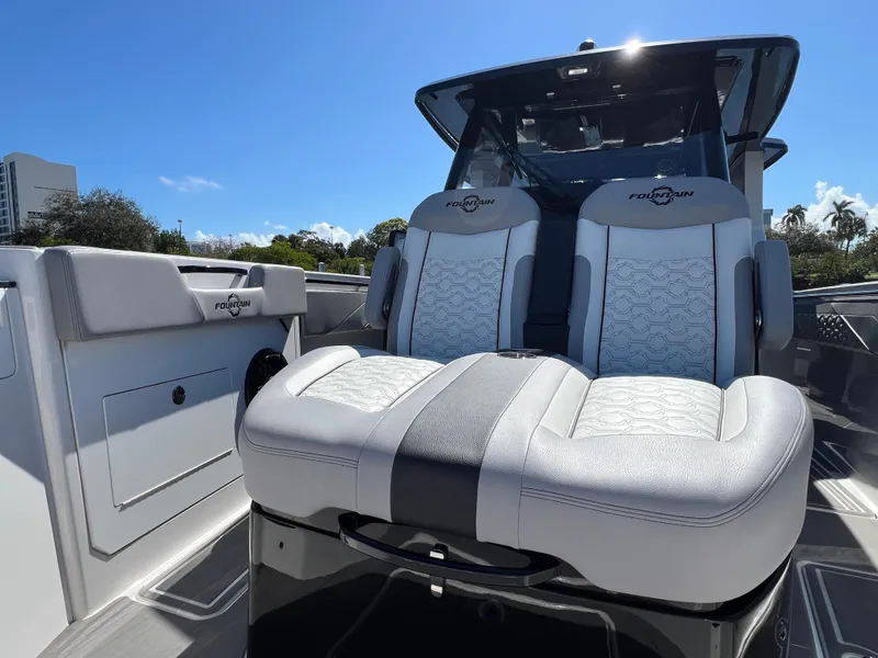 Slide: The Image of 2023 Fountain 38 SCX boat with luxurious seating and sleek design. - 12
