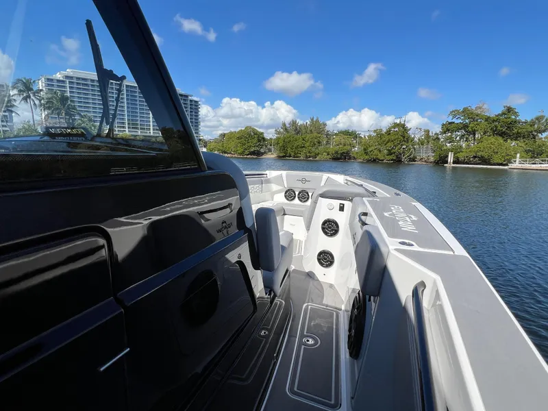 Slide: The Image of 2023 Fountain 38 SCX boat on calm water with clear blue sky. - 15