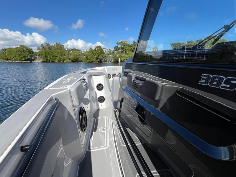 Slide: The Image of 2023 Fountain 38 SCX boat interior with sleek design on a sunny day. - 16