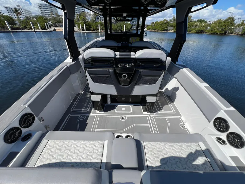 Slide: The Image of 2023 Fountain 38 SCX boat interior with modern seating and sleek design on the water. - 28