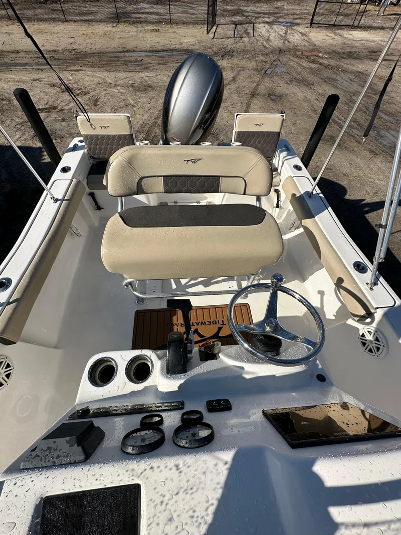 Slide: The Image of 2020 Tidewater 1900CC Bay Boat interior with steering wheel and seating. - 6