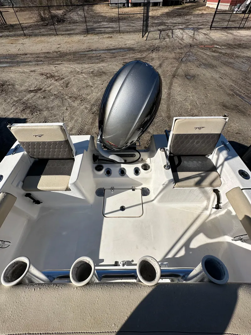 Slide: The Image of 2020 Tidewater 1900CC Bay Boat interior with seating and engine, viewed from above. - 7