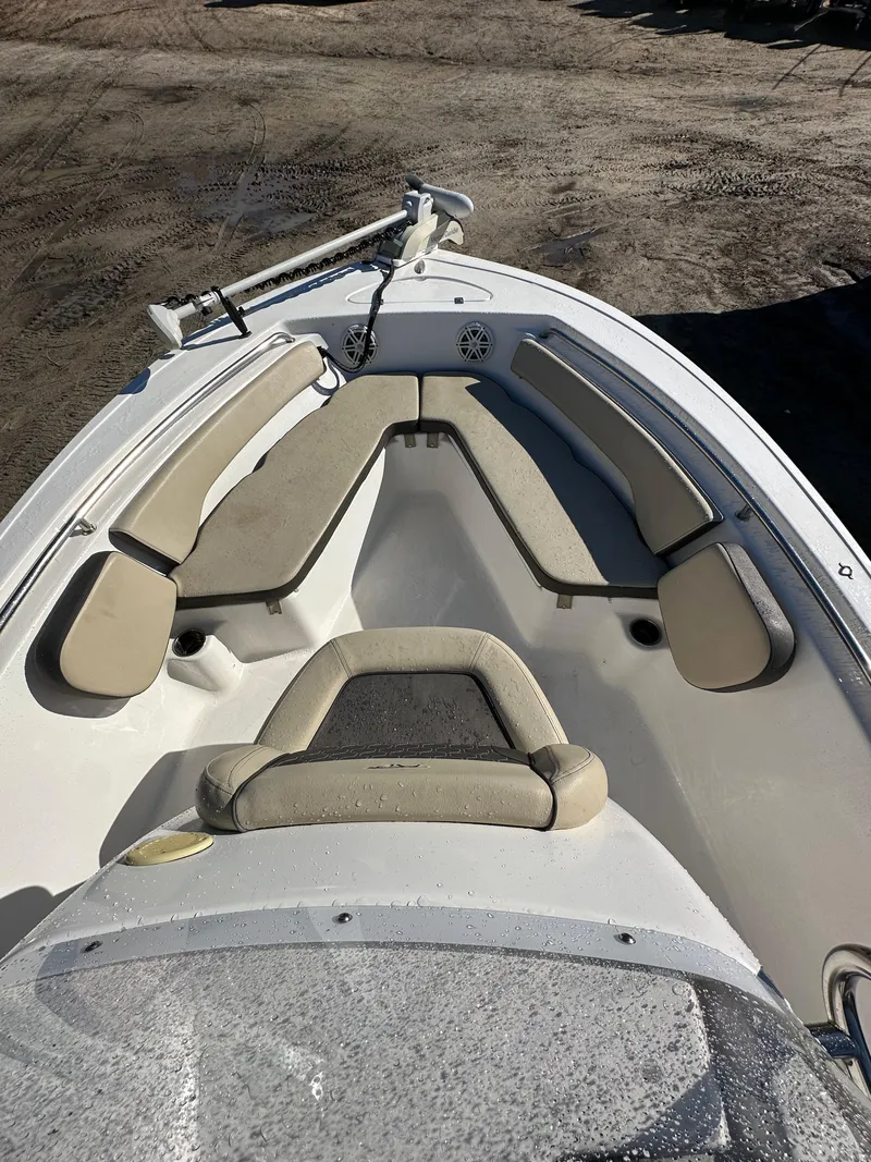 Slide: The Image of 2020 Tidewater 1900CC Bay Boat with cushioned seating and clean deck design. - 8