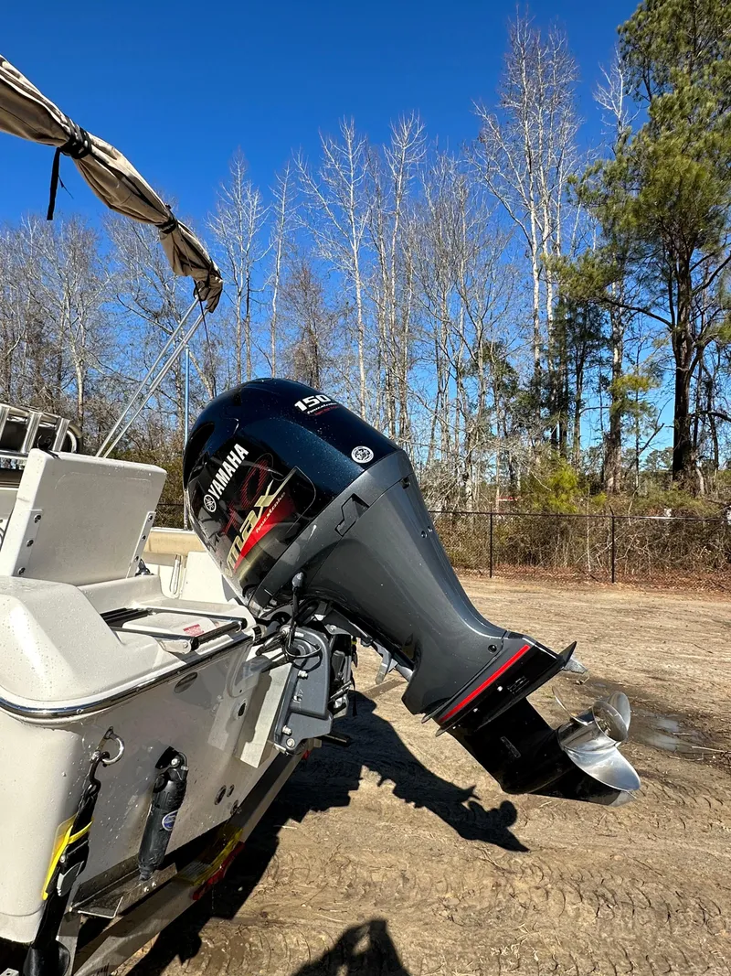 Slide: The Image of 2020 Tidewater 1900CC Bay Boat with Yamaha outboard motor, parked outdoors. - 9
