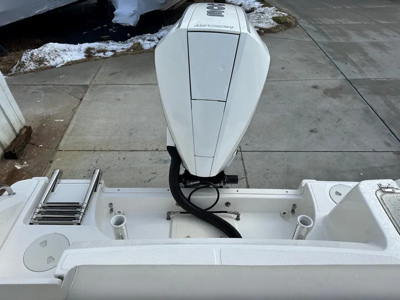 Slide: The Image of 2022 Boston Whaler 230 Outrage boat engine and deck view. - 11