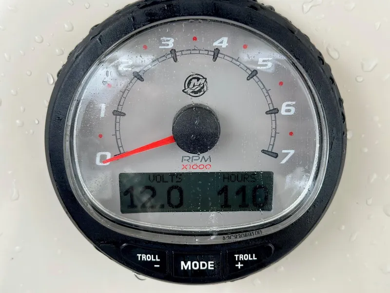 Slide: The Image of Tachometer of 2022 Boston Whaler 230 Outrage showing RPM, voltage, and hours. - 12