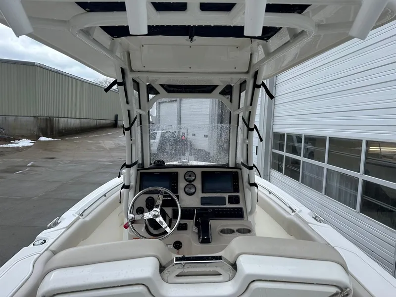 Slide: The Image of 2022 Boston Whaler 230 Outrage boat interior with steering console and navigation equipment. - 3
