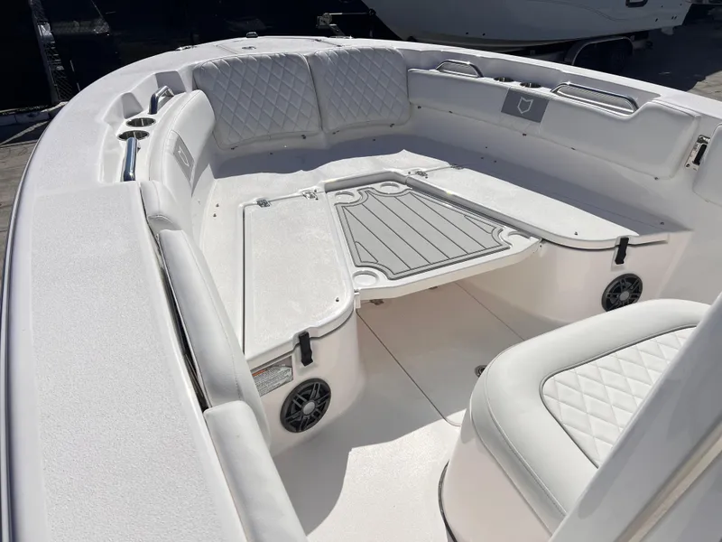Slide: The Image of 2025 Sea Fox 248 Commander boat interior with cushioned seating and storage compartments. - 11