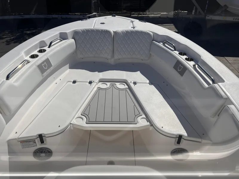 Slide: The Image of 2025 Sea Fox 248 Commander boat interior with cushioned seating and storage compartments. - 12