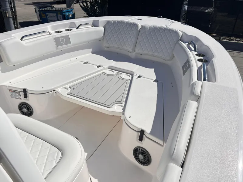 Slide: The Image of 2025 Sea Fox 248 Commander boat interior with white seating and deck. - 13