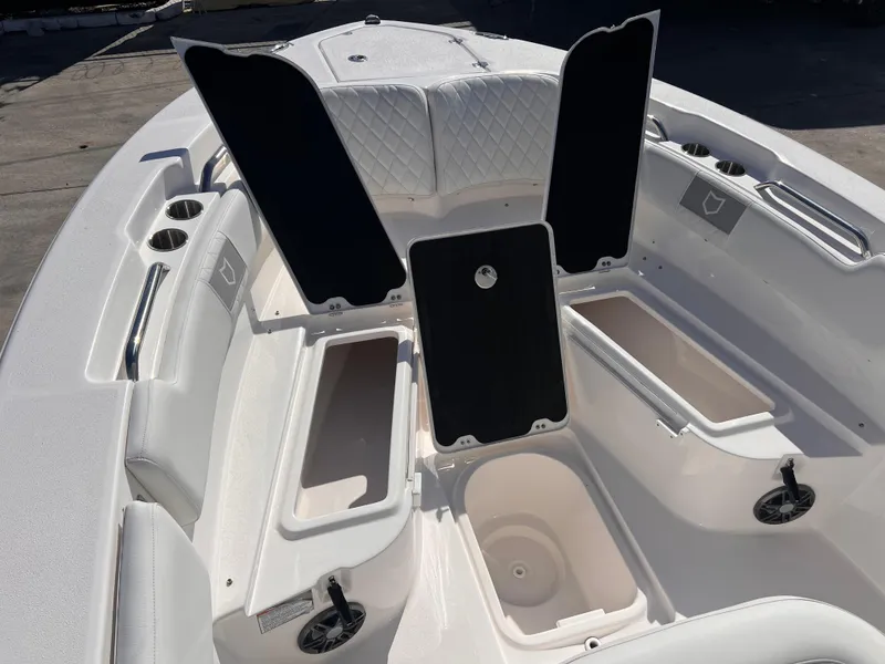 Slide: The Image of 2025 Sea Fox 248 Commander boat interior with open storage compartments and seating. - 14