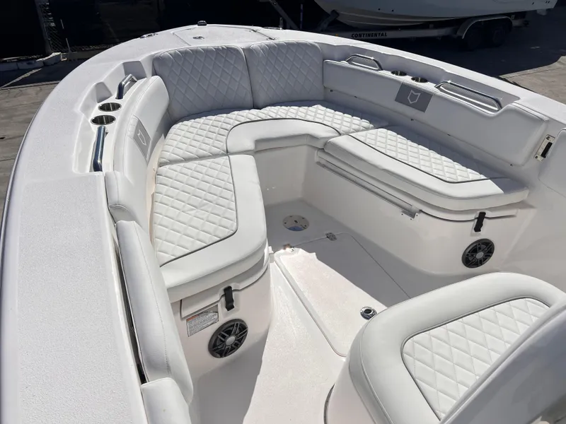 Slide: The Image of 2025 Sea Fox 248 Commander boat with white cushioned seating and modern design. - 18