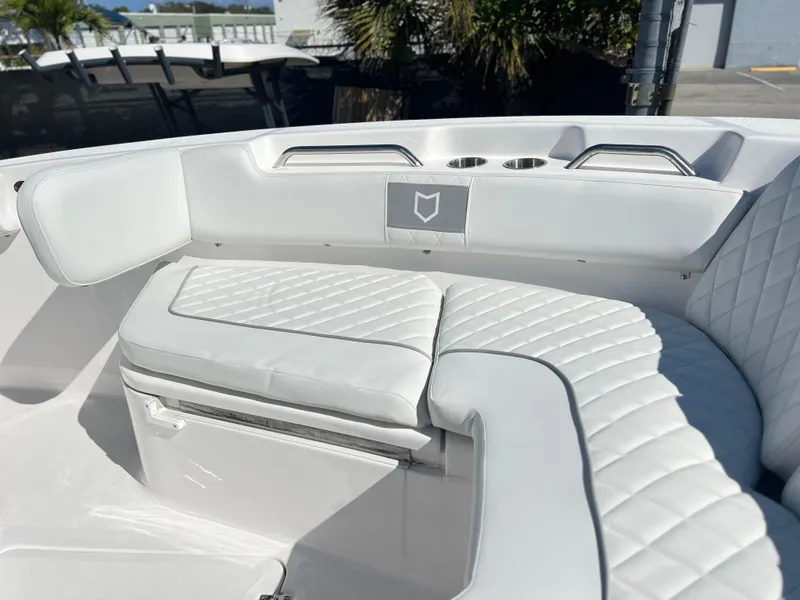 Slide: The Image of 2025 Sea Fox 248 Commander boat interior with white cushioned seating. - 20