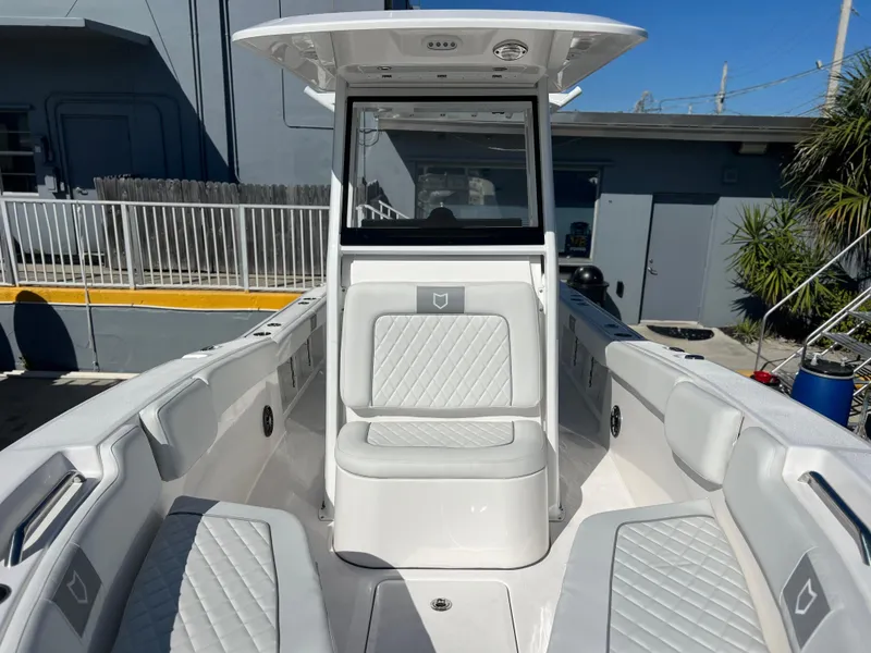 Slide: The Image of 2025 Sea Fox 248 Commander boat interior with cushioned seating and modern design. - 22