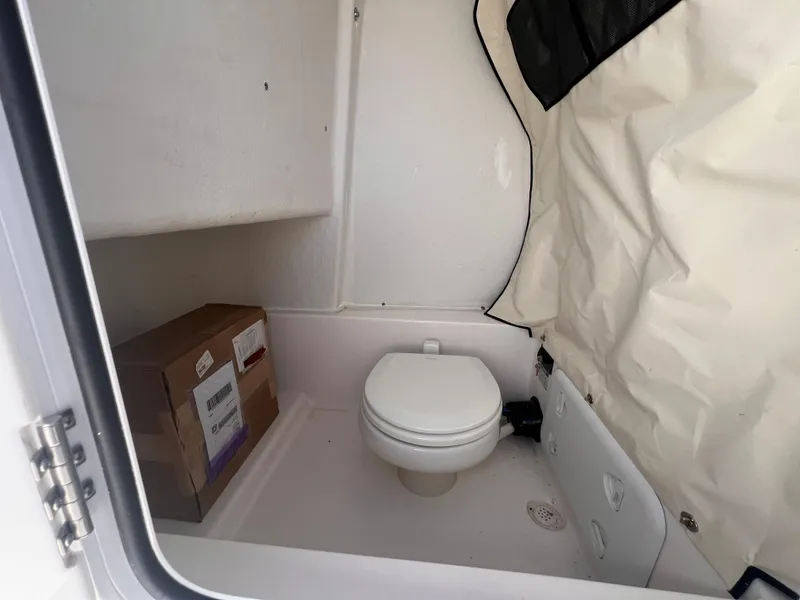 Slide: The Image of 2025 Sea Fox 248 Commander boat interior with compact marine toilet. - 27