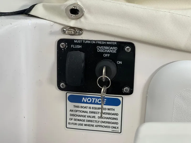 Slide: The Image of Control panel on a 2025 Sea Fox 248 Commander boat with discharge options. - 28