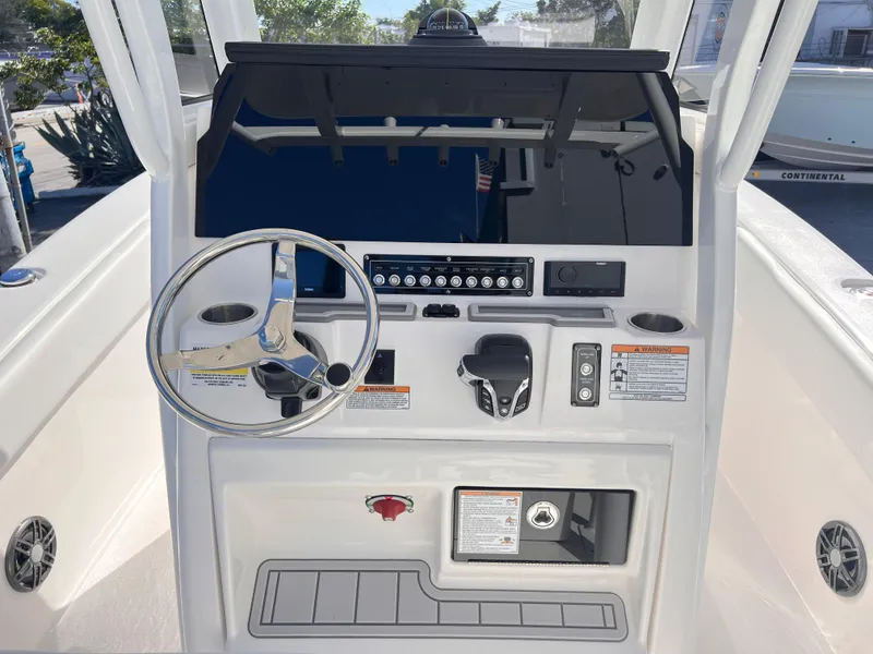 Slide: The Image of 2025 Sea Fox 248 Commander boat dashboard with steering wheel and control panel. - 34