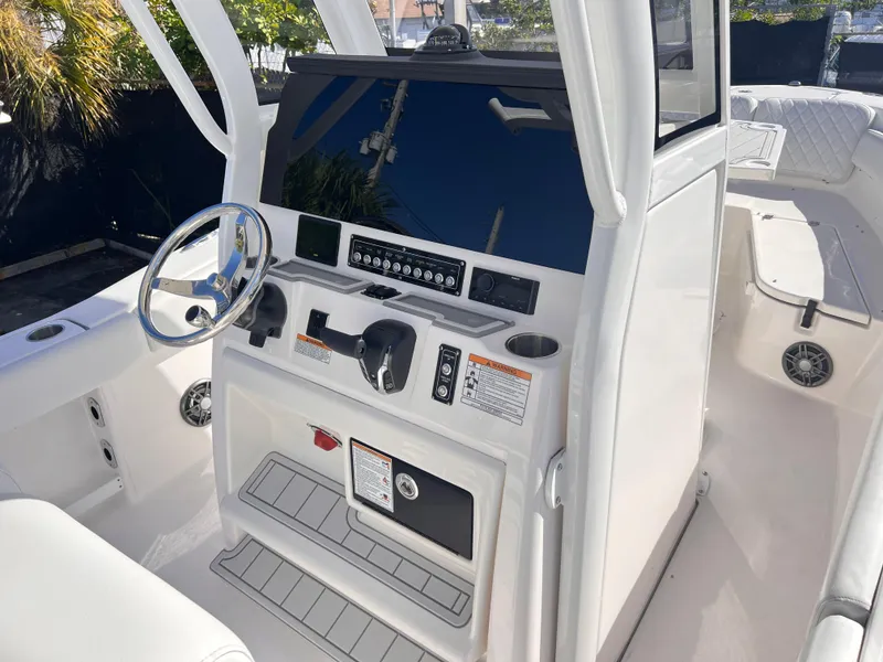 Slide: The Image of 2025 Sea Fox 248 Commander boat cockpit with steering wheel and control panel. - 35