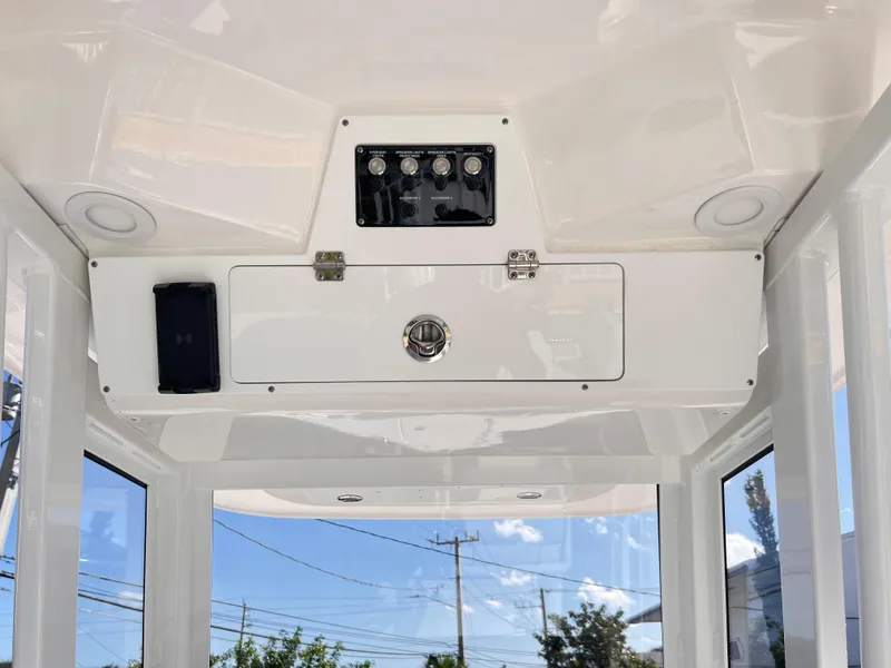 Slide: The Image of 2025 Sea Fox 248 Commander console with control panel and storage compartment. - 37