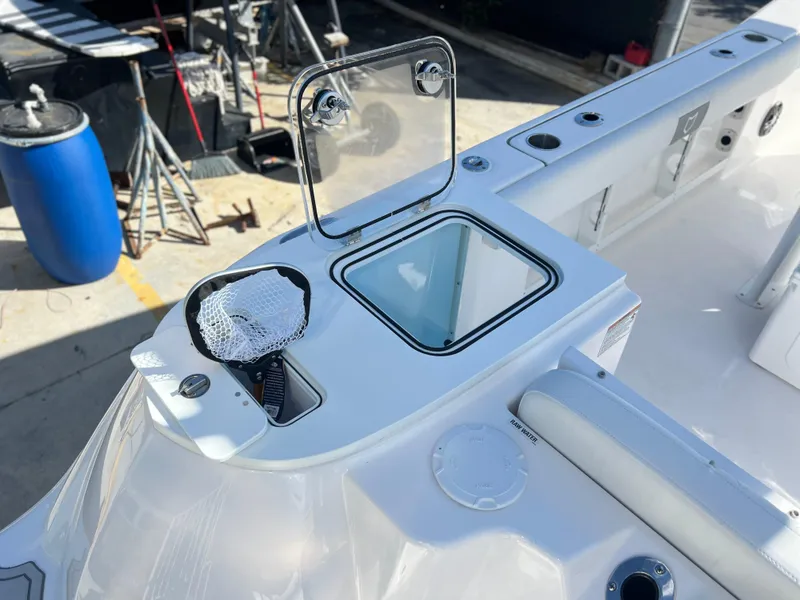 Slide: The Image of 2025 Sea Fox 248 Commander boat with open storage compartment and fishing net. - 43