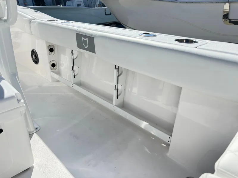 Slide: The Image of 2025 Sea Fox 248 Commander boat interior, featuring sleek white design and built-in storage compartments. - 47