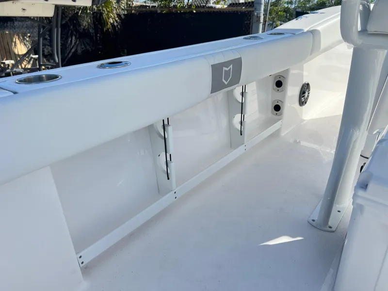 Slide: The Image of 2025 Sea Fox 248 Commander boat interior, featuring sleek white design and built-in storage compartments. - 48
