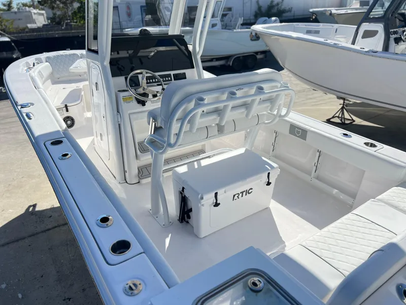 Slide: The Image of 2025 Sea Fox 248 Commander boat interior with seating and RTIC cooler. - 49