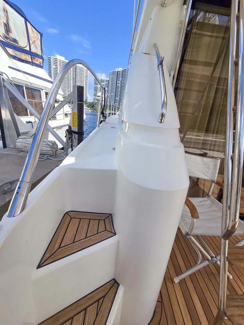 Slide: The Image of 1998 Viking Princess 56 Sport Cruiser with teak deck and modern railing. - 14